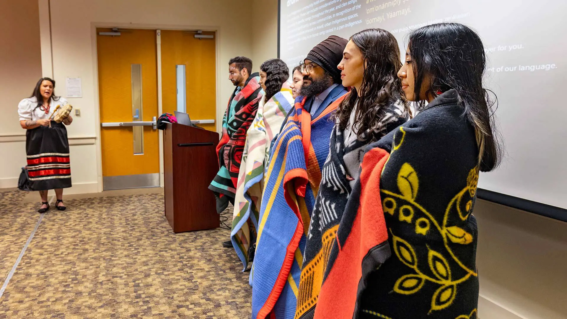 Graduating seniors with Native heritage were honored on Saturday at the university’s first blanket ceremony, a traditional Native celebration. Assistant Professor Shelbi Nahwilet Meissner led a drum ceremony at the event. Samuel Celentano, a December 2023 graduate (below), attended with his parents.