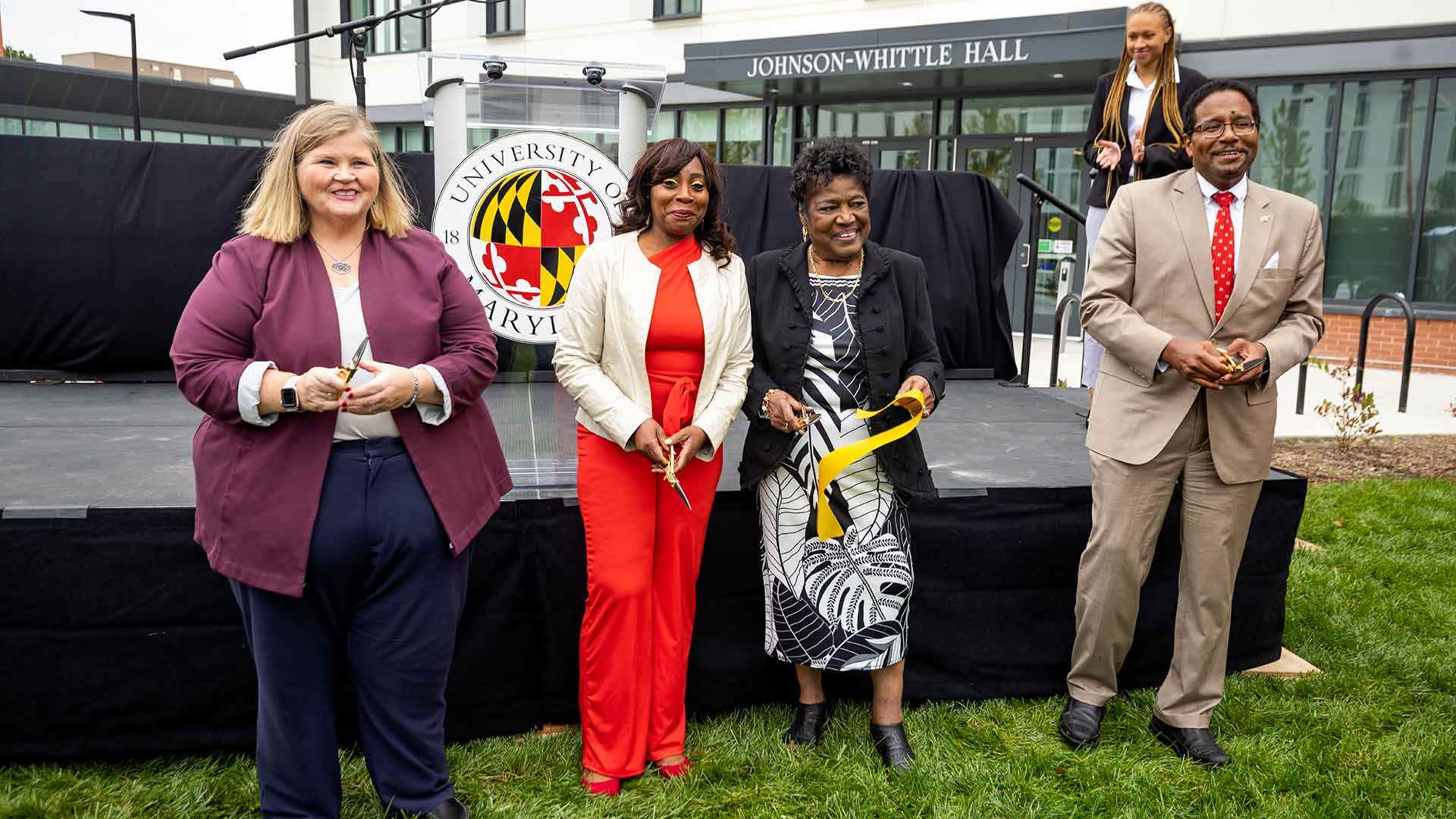 From left, Vice President for Student Affairs Patty Perillo; Glenise Whittle, the late Hiram Whittle's niece; Elaine Johnson Coates '59; and university President Darryll J. Pines cut the ribbon to dedicate Johnson-Whittle Hall today. Photo by Stephanie S. Cordle.