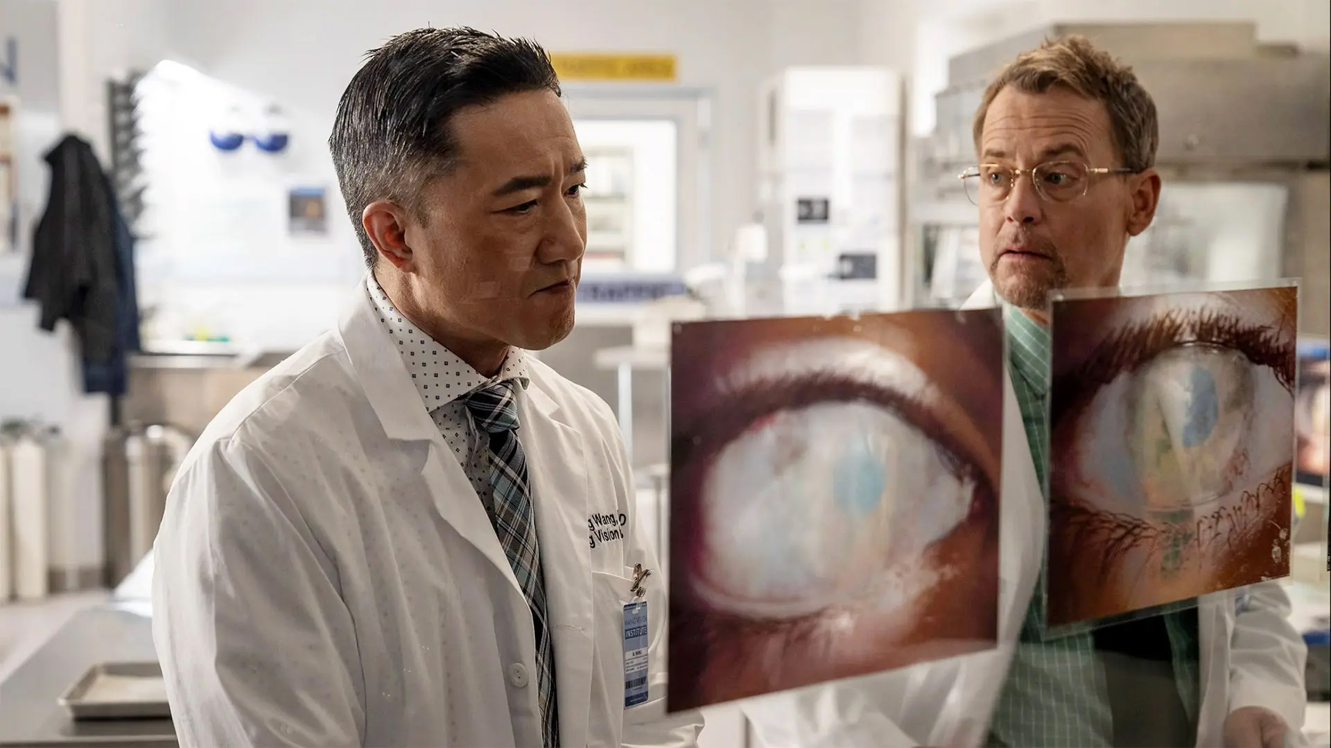 Actor Terry Chen (left) plays eye surgeon Ming Wang Ph.D. '86 in a film opening nationwide Friday that co-stars Greg Kinnear (right).