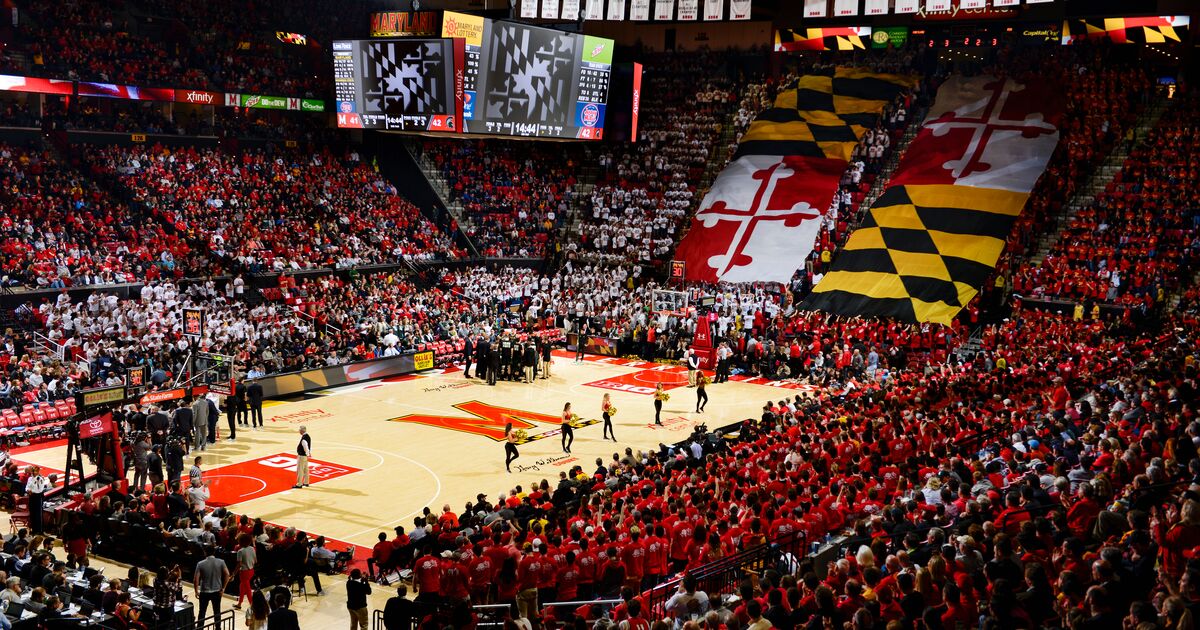 Maryland's state flag is unfurled across bleachers at a basketball game
